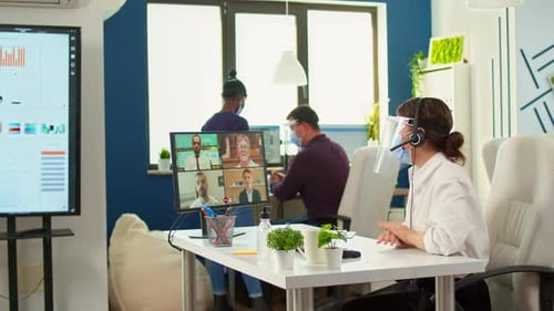 Team Meeting on Video Conference in Modern Office