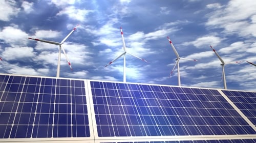 Solar Panels and Wind Turbines Passing By
