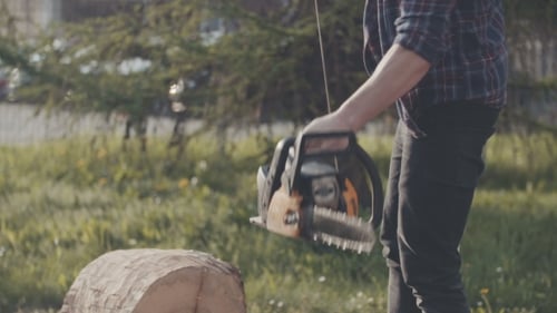 Cutting Wood With Chainsaw