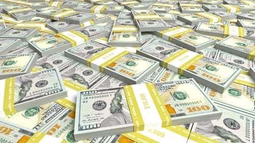 Piles of US 100 Dollar Bills Spreading Across a Surface