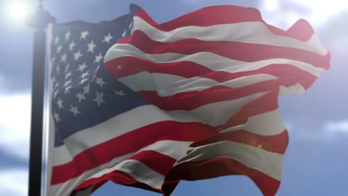 American Flag Waving in Wind with Sunlight Lens Flare