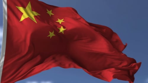 Realistic China Flag Waving Against Blue Sky