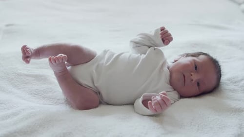 Close-up portrait of a young baby who has recently been born.