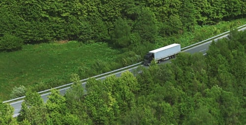 Cargo Truck Driving In Mountains, Mountain River With Road and Domestic Cows