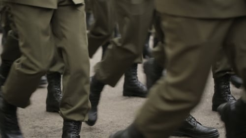 Soldiers Feet Walking By the Street