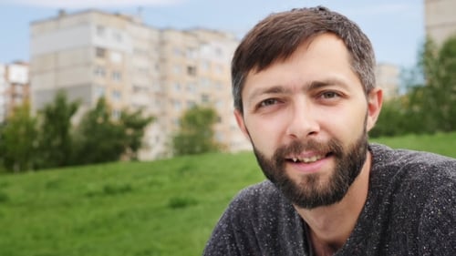Smiling Man Portrait in Urban Park Setting