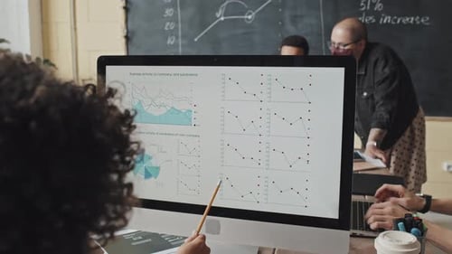 Business Team Analyzing Data in Modern Office