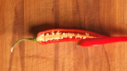 Red Chili Pepper Being Sliced Open Close Up