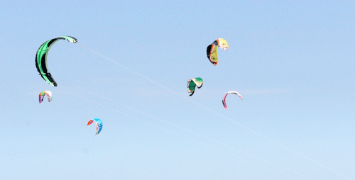 Colorful Kites Flying High Above Beach