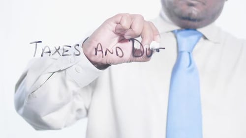 Asian Businessman Writes Taxes And Duty
