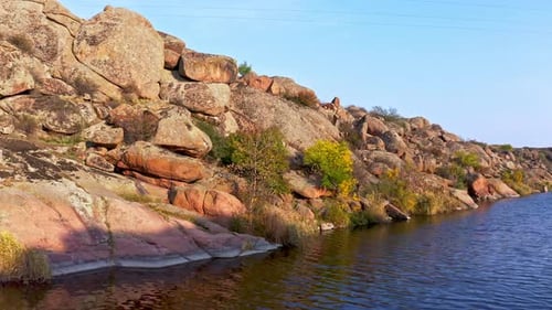 A Smooth Shining Stream Flows Among Large Boulders
