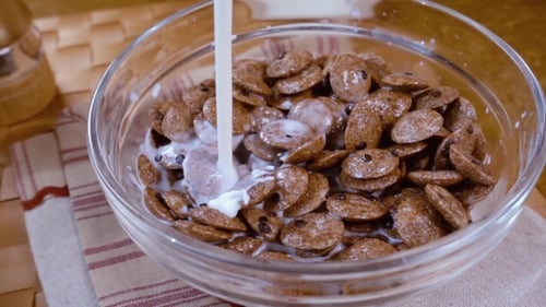 Pouring Milk into a Bowl of Cereal