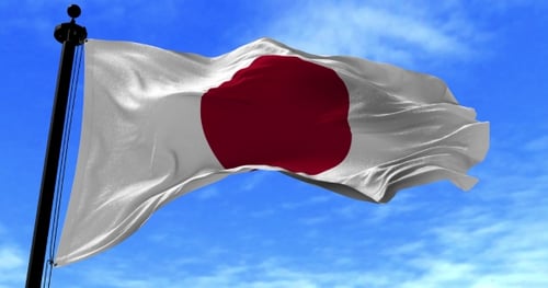 Waving Japan Flag Animation Against Blue Sky
