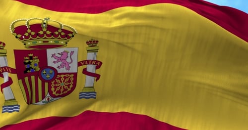Realistic Spain Flag Waving Against Blue Sky