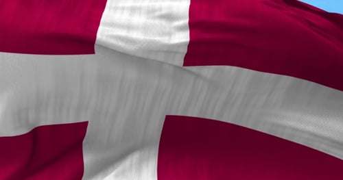 Realistic Denmark Flag Waving Against Blue Sky