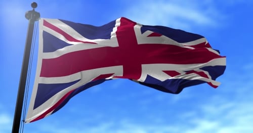 Realistic Waving Union Jack Flag on Clear Blue Sky