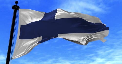 Realistic Finland Flag Waving Against a Clear Blue Sky
