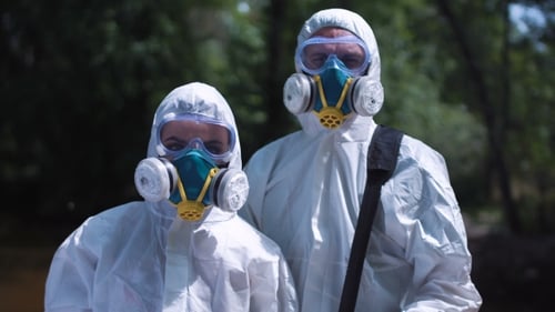 People Wearing Protective Suits and Respirators