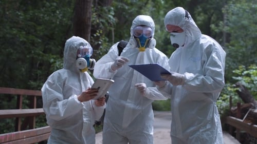 Researchers in Protective Suits Studying Nature