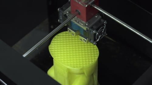 3D Printer Making Yellow Object