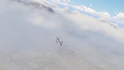 Drone Flying Above Clouds Over Majestic Mountains