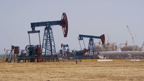 Oil Pumps Extracting Oil in Desert Landscape