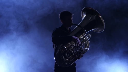 Musician in a Smoky Studio Playing in a Tuba, Silhouette