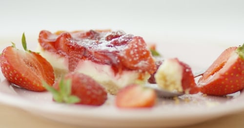 Decadent Strawberry Cheesecake with Fresh Strawberries and Sugar
