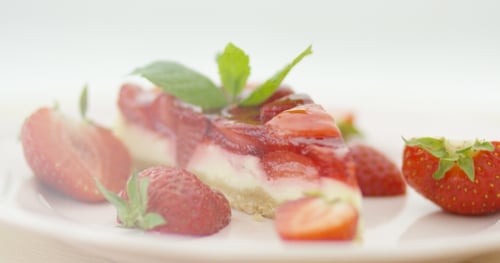 Strawberry Cheesecake Slice with Fresh Mint and Strawberries