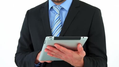 Smiling Man Using Tablet Device in Studio
