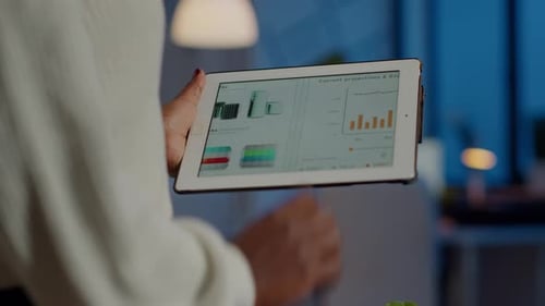 Close Up of Black Entrepreneur Analysing Financial Reports Zoom in
