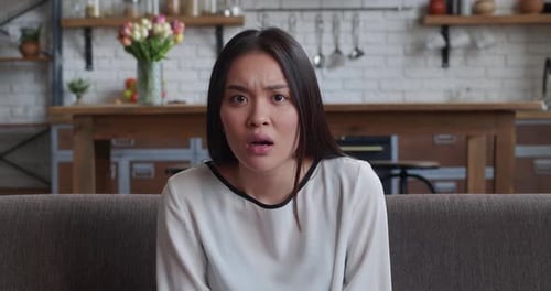Shocked Woman Reacts with Fear and Surprise