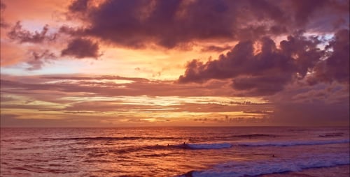 Surfers At Sunset