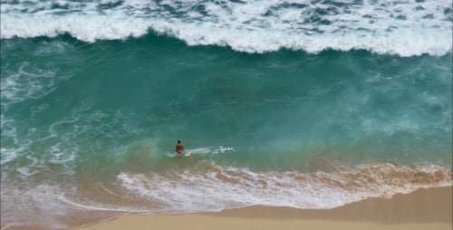 A Man Goes To Swim In The Ocean