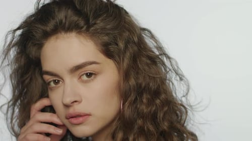 Young Woman with Curly Hair Posing