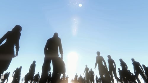 Silhouettes of People Walking Towards Bright Light in Sky