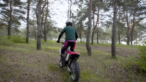 Extreme Cross Road Riding. Biker on Enduro Bike Riding Motocross in the Forest.