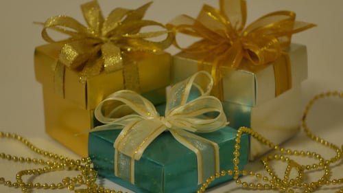 Assorted Gift Boxes with Gold Ribbons and Beads