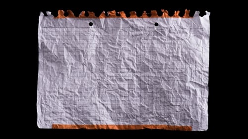 Crumpled Paper Unfolds Against Black Background
