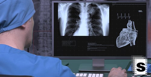 Surgeon Looking Medical Data