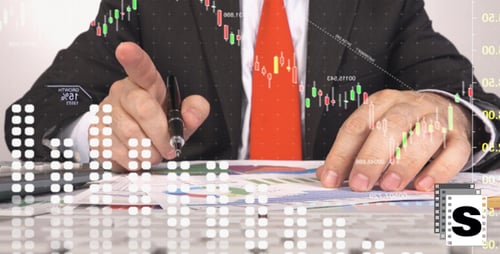 Adult Analyzing Financial Charts in Workplace