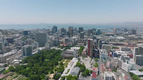Aerial Panoramic Footage of Tall Buildings in City Centre and Water in Sea Bay in Background