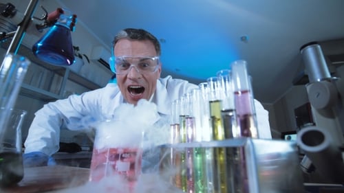 Crazy Scientist With Smoking Beaker in Lab
