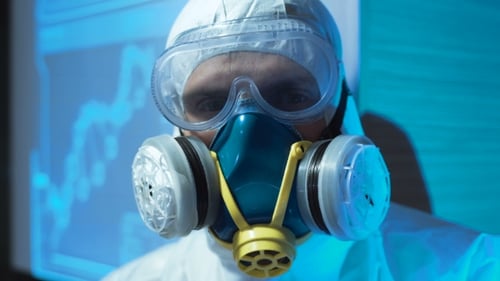 Close Up of Scientist Wearing Protective Hazmat Suit