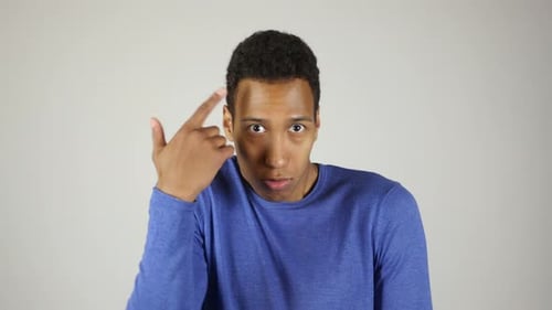 Young Man Gesturing and Speaking to Camera