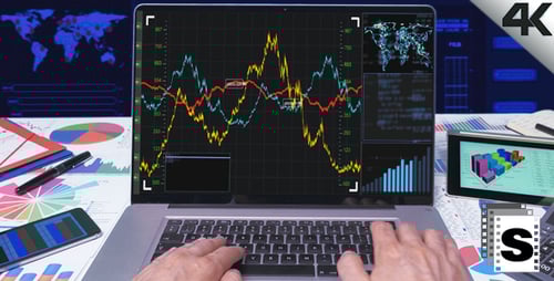Hands Typing on Laptop Analyzing Data Charts