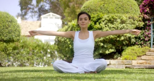 Woman Meditating, Stretching in Green Garden