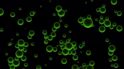 Oil green drops moving in water
