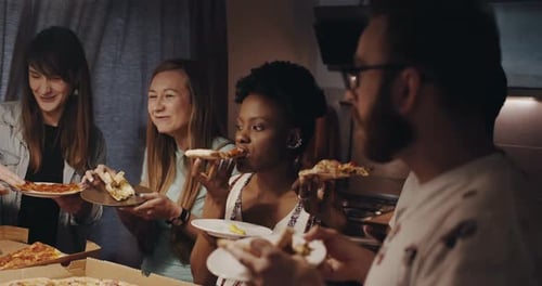 Beautiful Young Multiethnic Women Chat, Smile Eating Pizza Hanging Out with Friends at Kitchen House