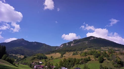 A small village in the valley, the peaks of the Carpathian mountains